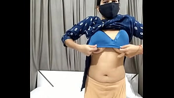 girls removes clothes with bra in front of boys
