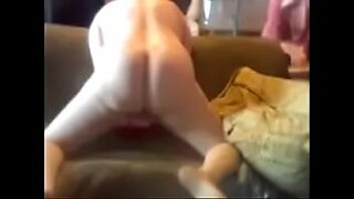 busty milf getting her nipples sucked while giving handjob for guy on the couch mom