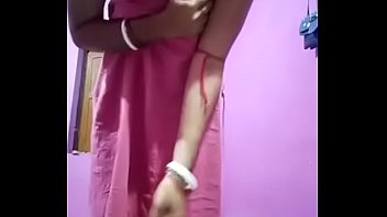 hot and sexy brunette does a pole dance and shows boobs