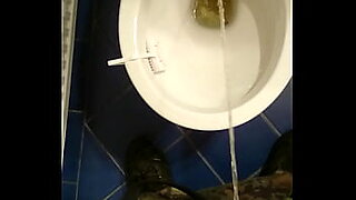pissing male in toilet