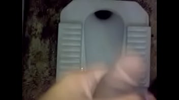 pissing male in toilet