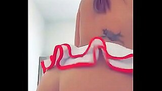 hot and sexy brunette does a pole dance and shows boobs